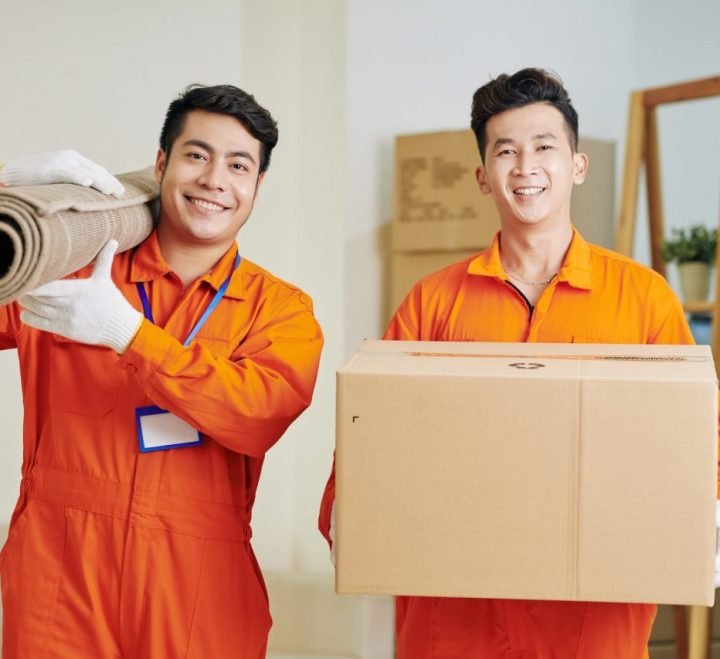 movers-carrying-carpet-and-cardboard-box.jpg